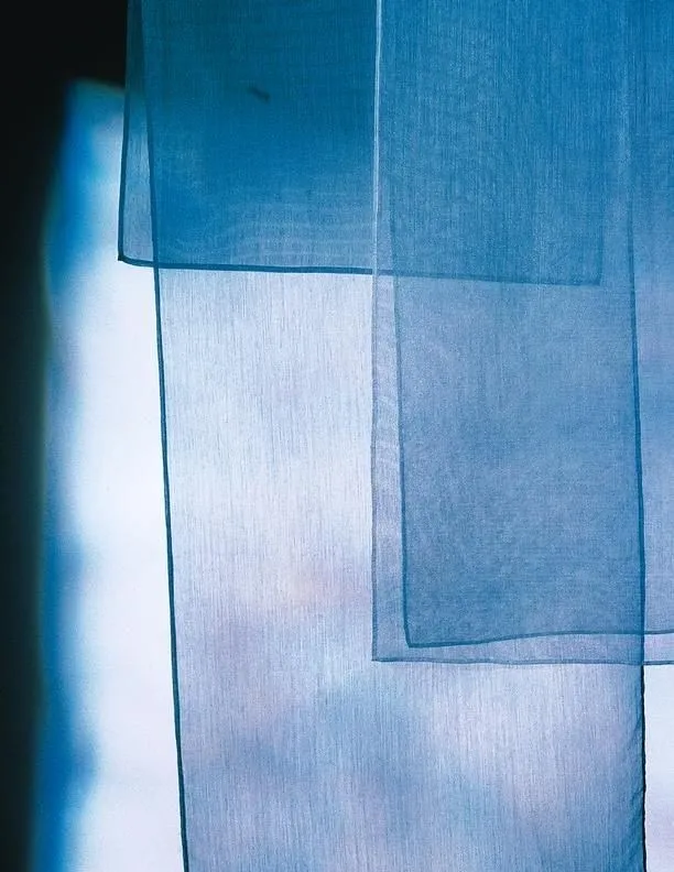Layers of blue silk against the light